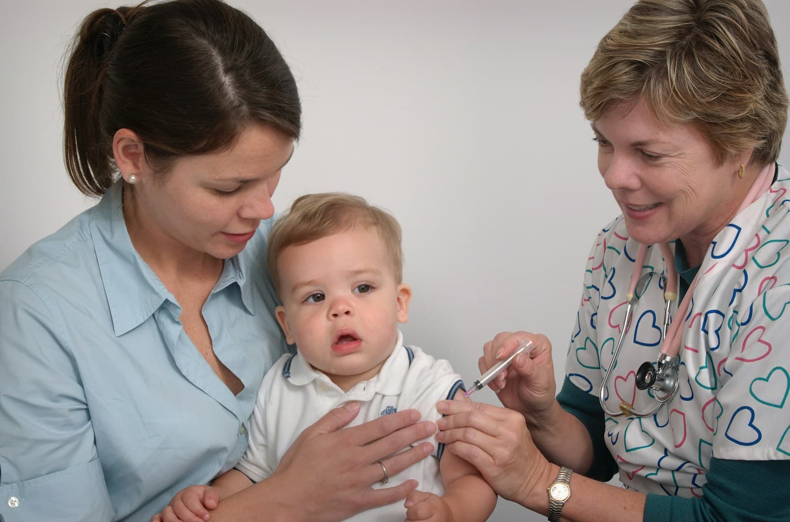 Pediatric nurse caring for an infant patient